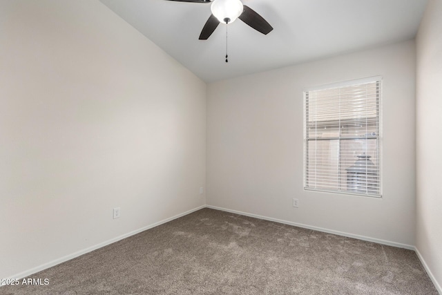 carpeted empty room featuring baseboards and ceiling fan