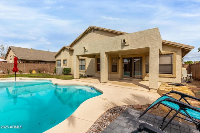 view of pool with central air condition unit, a patio area, a fenced in pool, and a fenced backyard