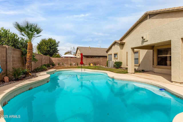 view of pool with a fenced in pool, a fenced backyard, and a patio area