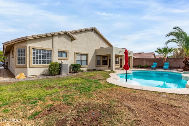 view of pool with a fenced in pool, central AC, a lawn, and a fenced backyard