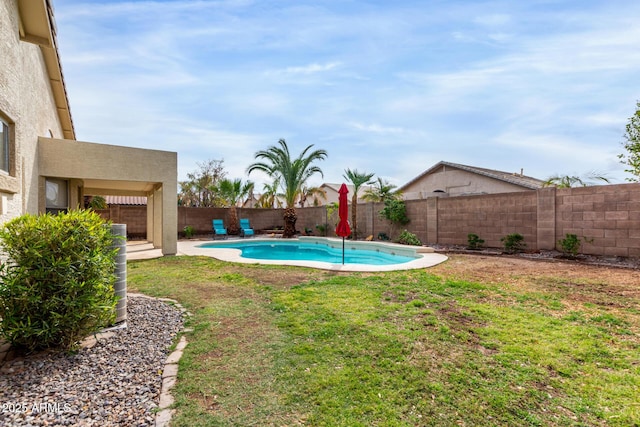 view of swimming pool featuring a yard, a fenced in pool, and a fenced backyard