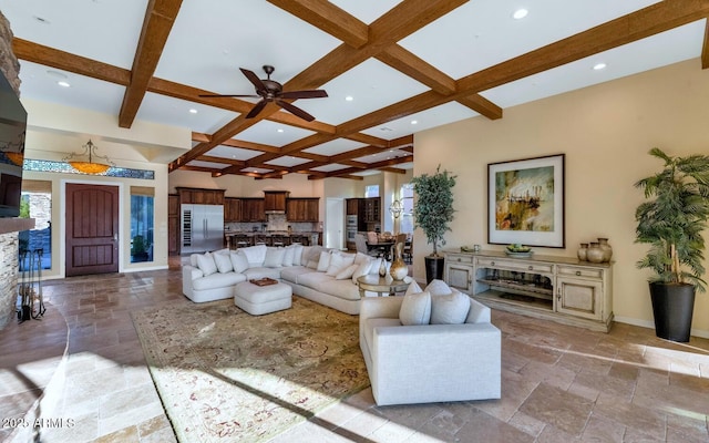 living room featuring coffered ceiling, beam ceiling, and ceiling fan