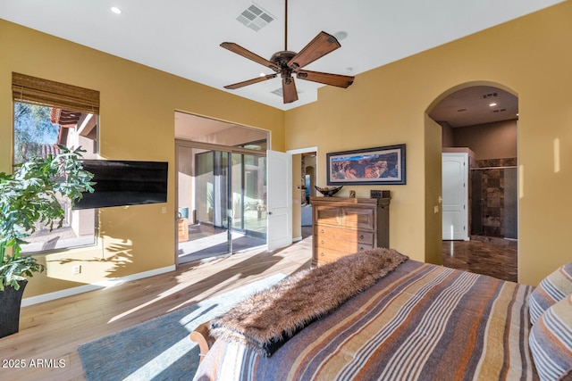 bedroom featuring access to outside, light hardwood / wood-style floors, and ceiling fan