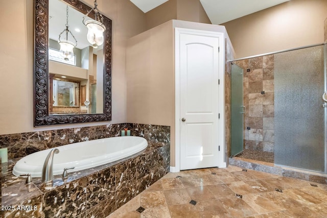 bathroom with separate shower and tub