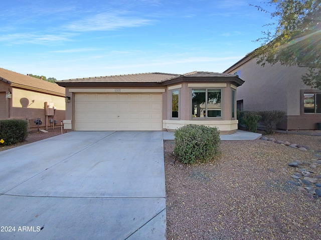 view of front of property with a garage