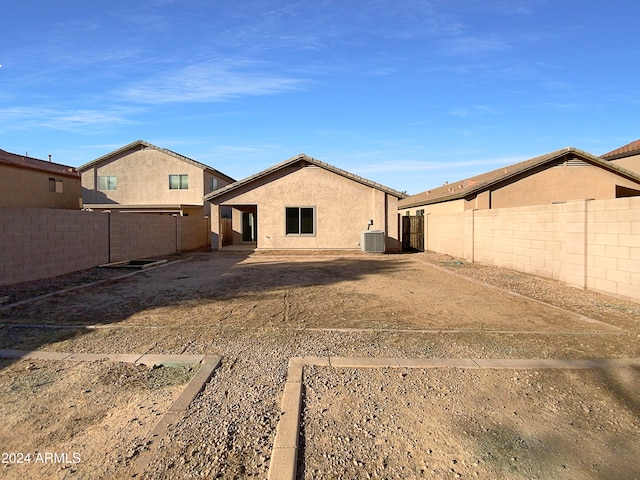 back of property featuring cooling unit