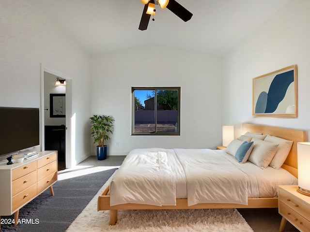 carpeted bedroom featuring ceiling fan and vaulted ceiling