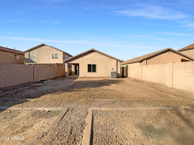 back of house featuring central AC