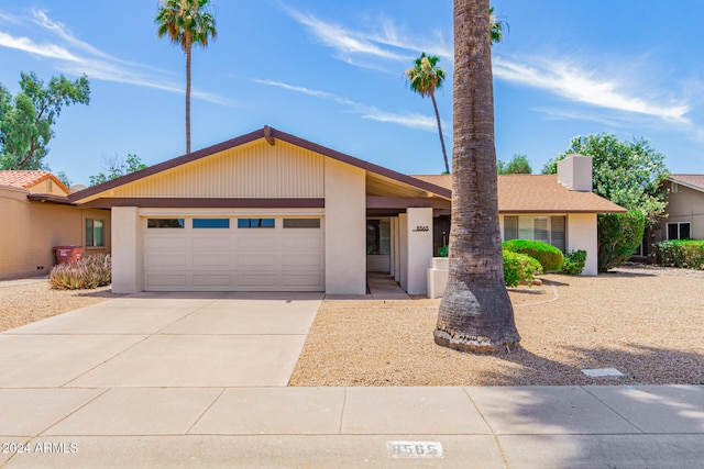 single story home featuring a garage