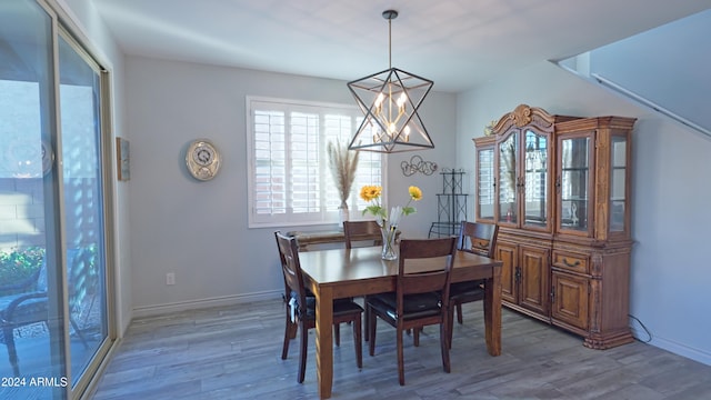 dining space with wood-type flooring