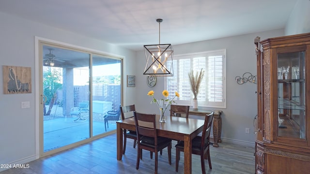 dining area with hardwood / wood-style flooring and ceiling fan