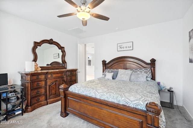 bedroom with light carpet and ceiling fan