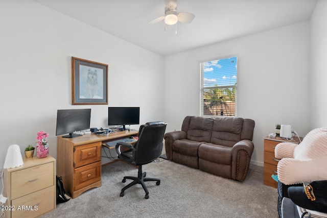 carpeted home office with ceiling fan