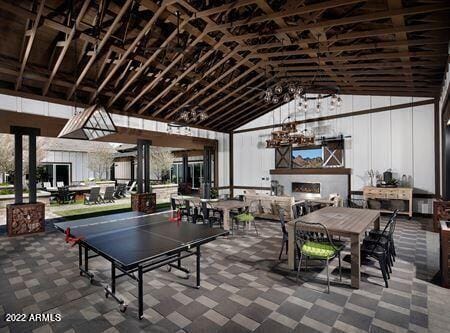 playroom featuring lofted ceiling