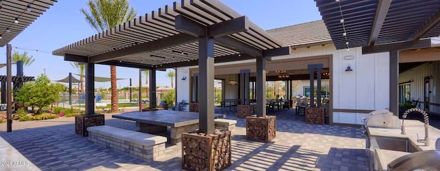 view of patio / terrace featuring a pergola and exterior kitchen