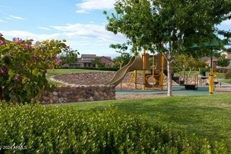 view of jungle gym featuring a lawn