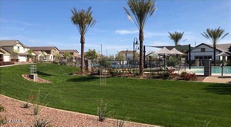 view of home's community featuring a pool and a yard