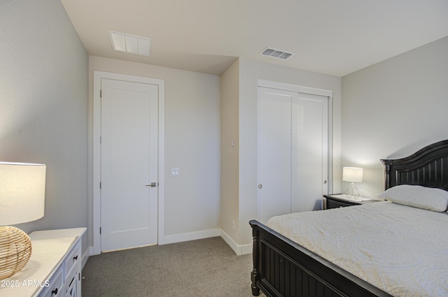 bedroom featuring light carpet, a closet, visible vents, and baseboards