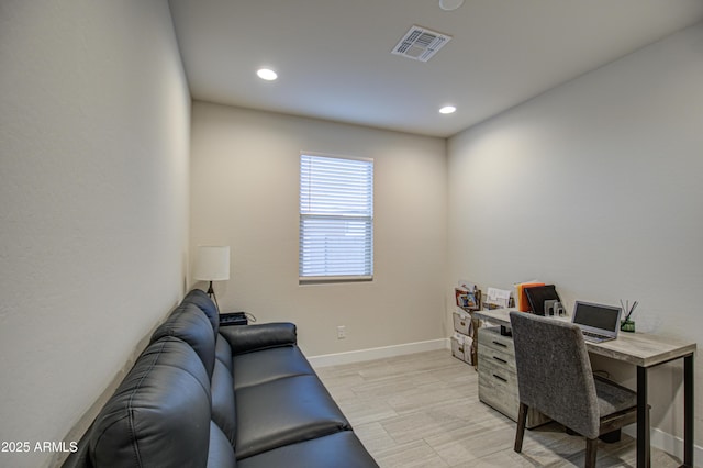 office area featuring light wood-style floors, recessed lighting, visible vents, and baseboards