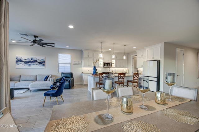 dining area with ceiling fan, visible vents, and recessed lighting