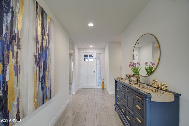 interior space with recessed lighting and baseboards