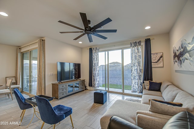 living area with a ceiling fan, wood finish floors, and recessed lighting