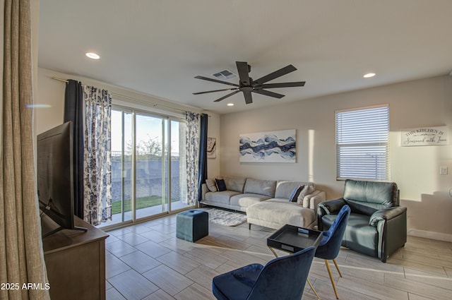 living area with visible vents, wood finish floors, a ceiling fan, and recessed lighting