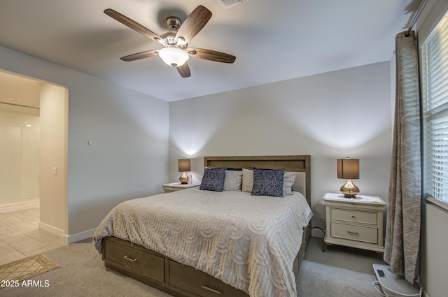 bedroom featuring baseboards, a ceiling fan, and light colored carpet