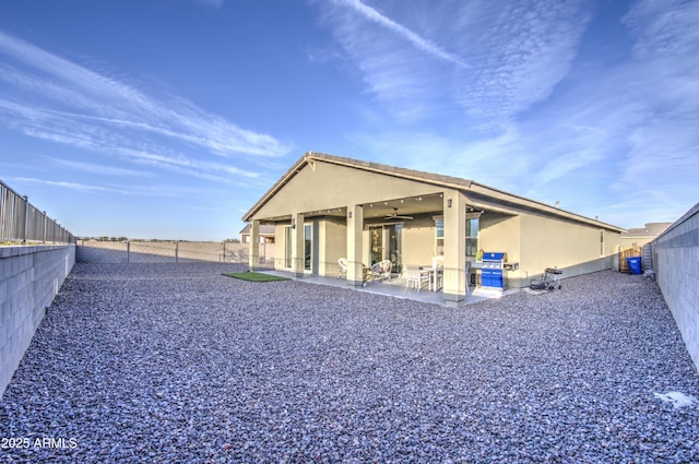 back of property featuring a patio area, a fenced backyard, and stucco siding