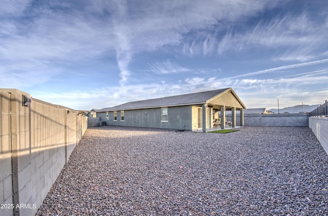 back of house with a patio area and a fenced backyard