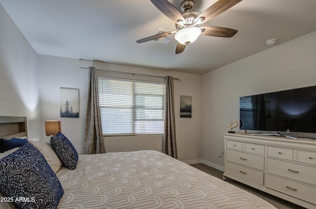 bedroom featuring baseboards and a ceiling fan