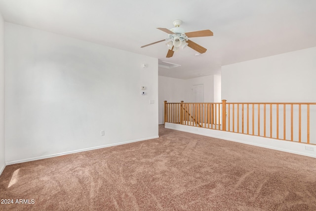 carpeted empty room featuring ceiling fan