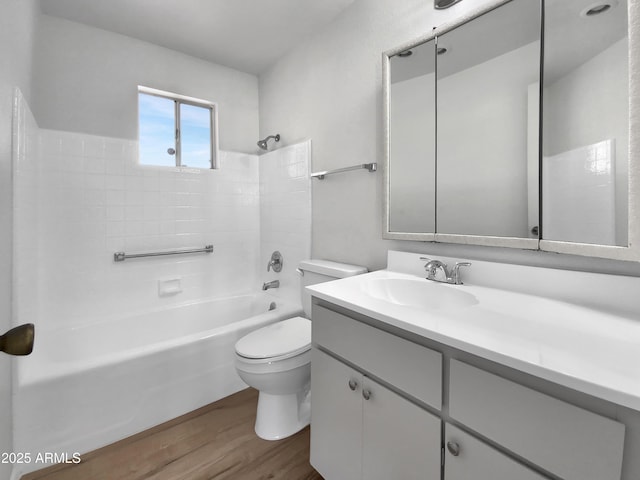 full bathroom with vanity, shower / bathing tub combination, toilet, and wood finished floors