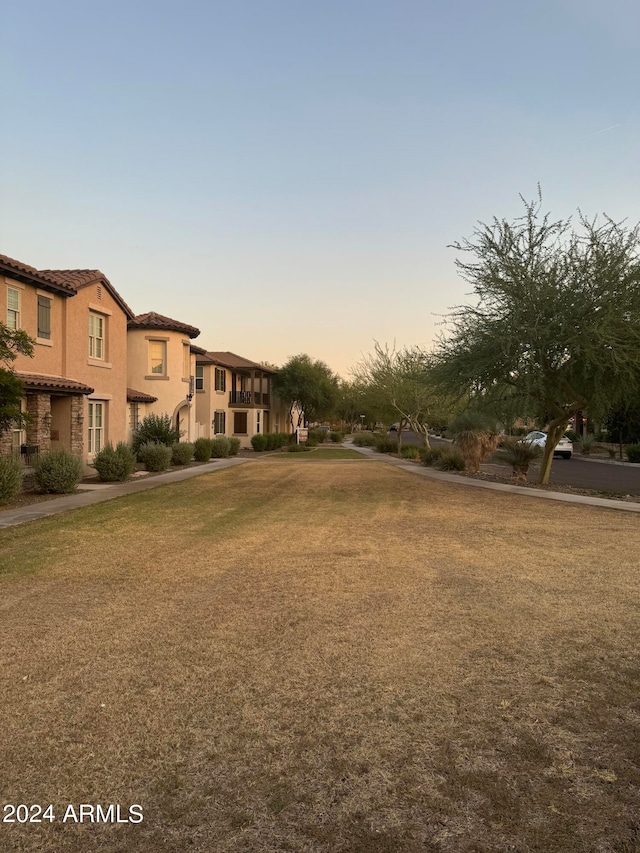 view of property's community with a lawn