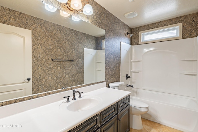 full bathroom with tile patterned floors, vanity,  shower combination, and toilet