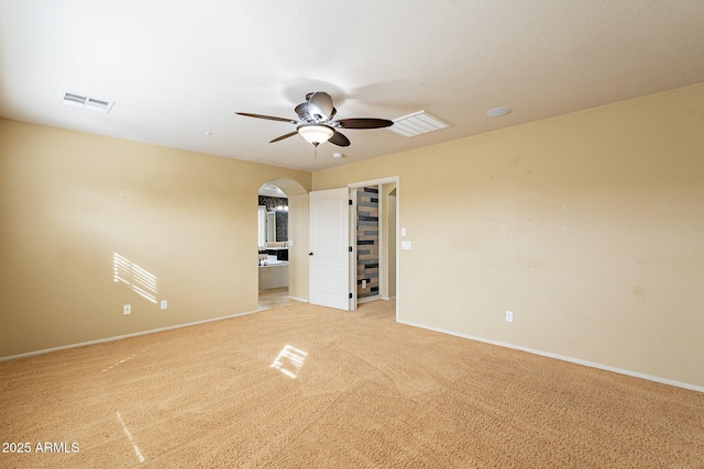 empty room with light carpet and ceiling fan