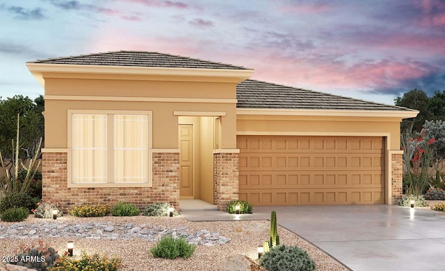 prairie-style house featuring a garage