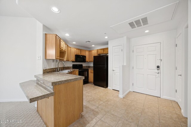 14000 N 94th St Unit 3198, Scottsdale, AZ 85260 - kitchen featuring black appliances, a peninsula, recessed lighting, a breakfast bar area, and light tile patterned flooring