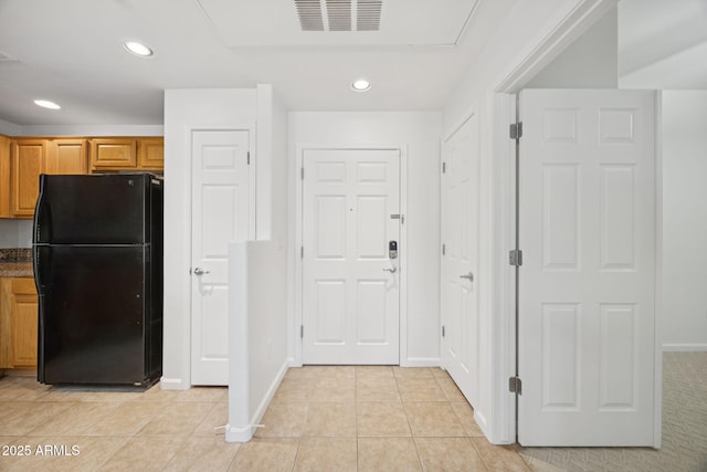 14000 N 94th St Unit 3198, Scottsdale, AZ 85260 - kitchen featuring freestanding refrigerator, recessed lighting, light tile patterned flooring, dark countertops, and brown cabinets