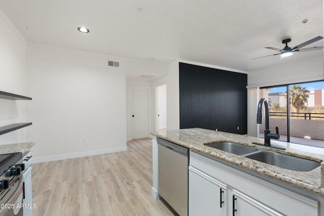 kitchen with white cabinetry, sink, ornamental molding, stainless steel appliances, and light wood-type flooring