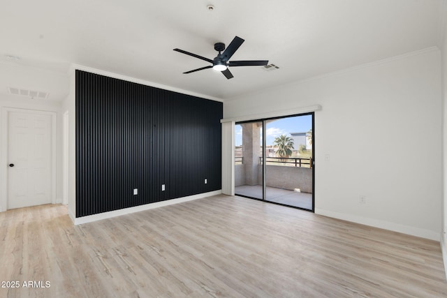 spare room with light hardwood / wood-style flooring, ornamental molding, and ceiling fan