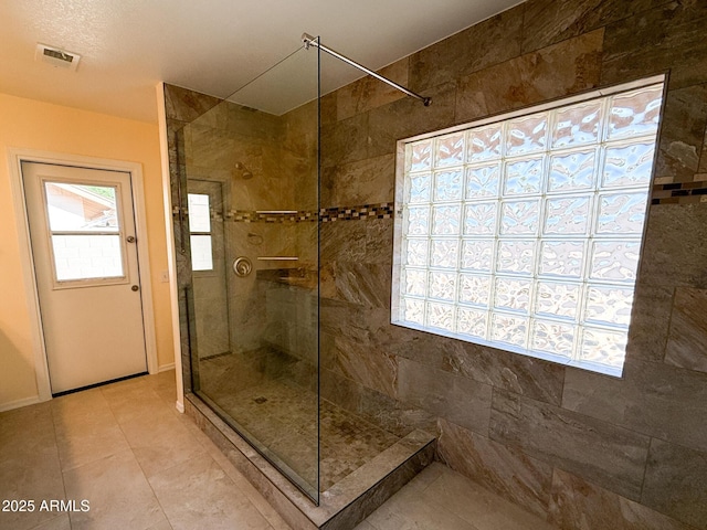 17371 N 86th Ave, Peoria, AZ 85382 - bathroom with a shower stall, tile patterned floors, and baseboards