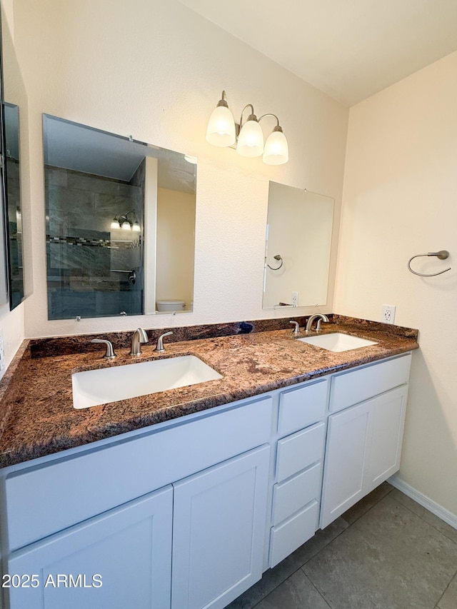 17371 N 86th Ave, Peoria, AZ 85382 - bathroom featuring double vanity, tile patterned floors, and tiled shower