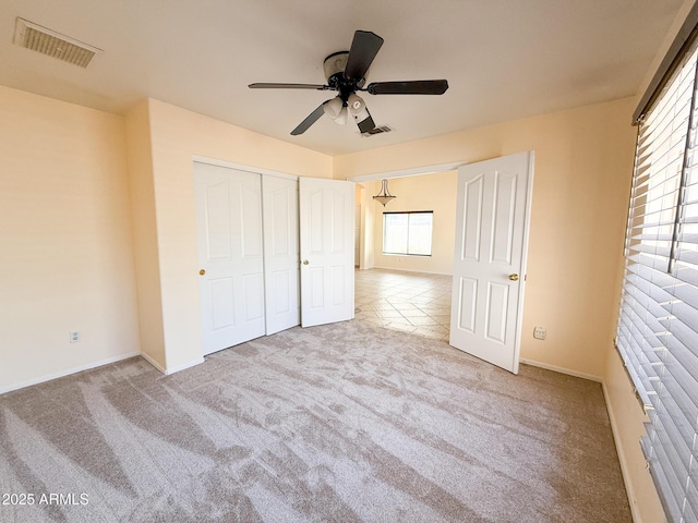 17371 N 86th Ave, Peoria, AZ 85382 - unfurnished bedroom featuring carpet floors, a closet, ceiling fan, and baseboards