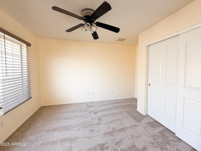 17371 N 86th Ave, Peoria, AZ 85382 - unfurnished bedroom with carpet floors, a closet, baseboards, and ceiling fan