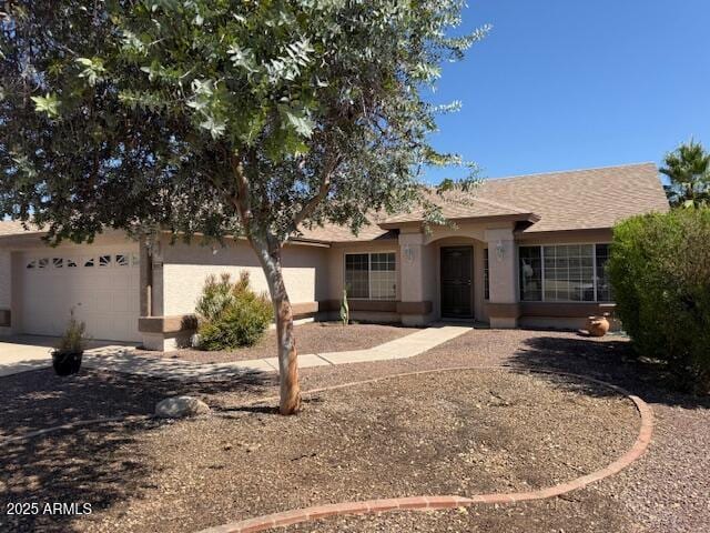 17371 N 86th Ave, Peoria, AZ 85382 - ranch-style house with an attached garage, driveway, and stucco siding