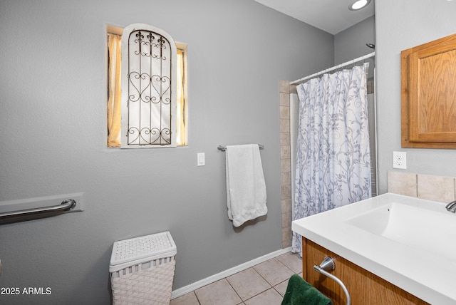 bathroom with vanity, tile patterned flooring, and curtained shower