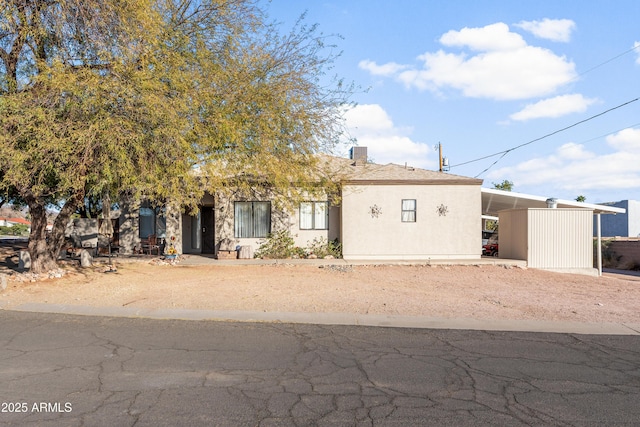 view of front of home featuring a carport