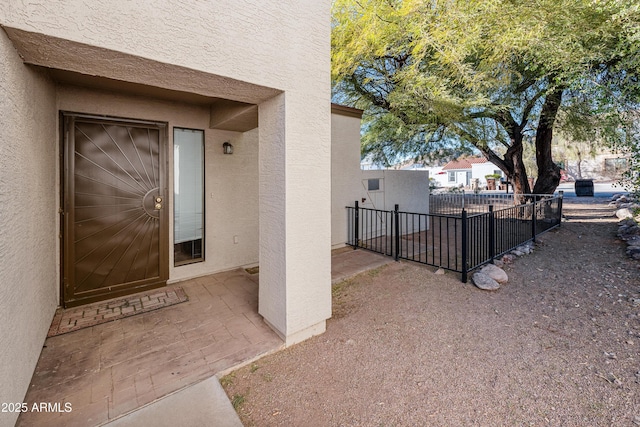 property entrance with a patio