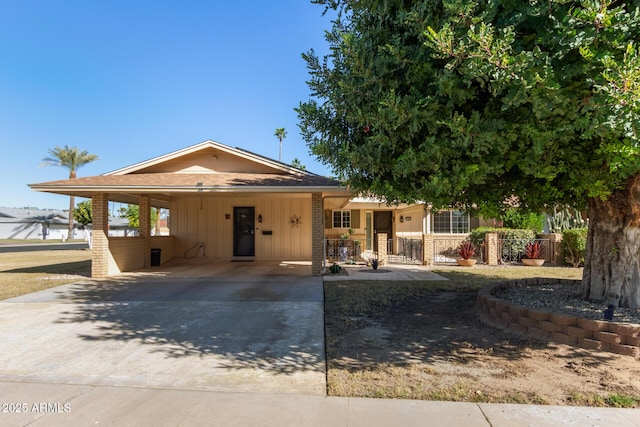 view of front of property featuring a carport